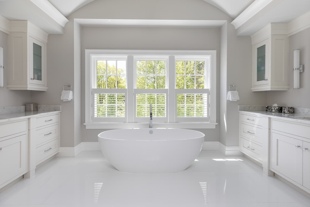 8 Hidden Road Weston, MA 02493 - Photo 20 of 42 a spacious bathroom with sink shower and mirror