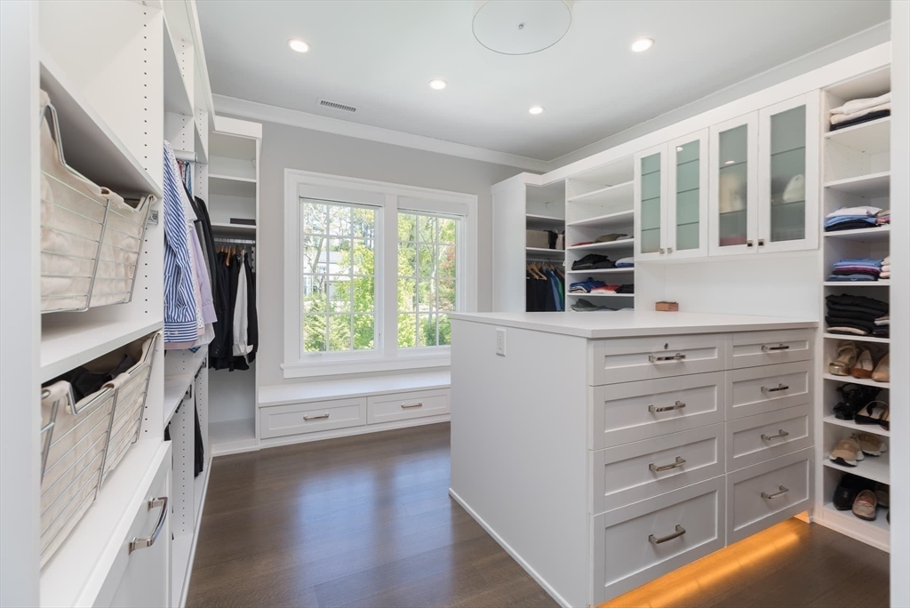 8 Hidden Road Weston, MA 02493 - Photo 22 of 42 a view of walk in closet with clothes and shoes