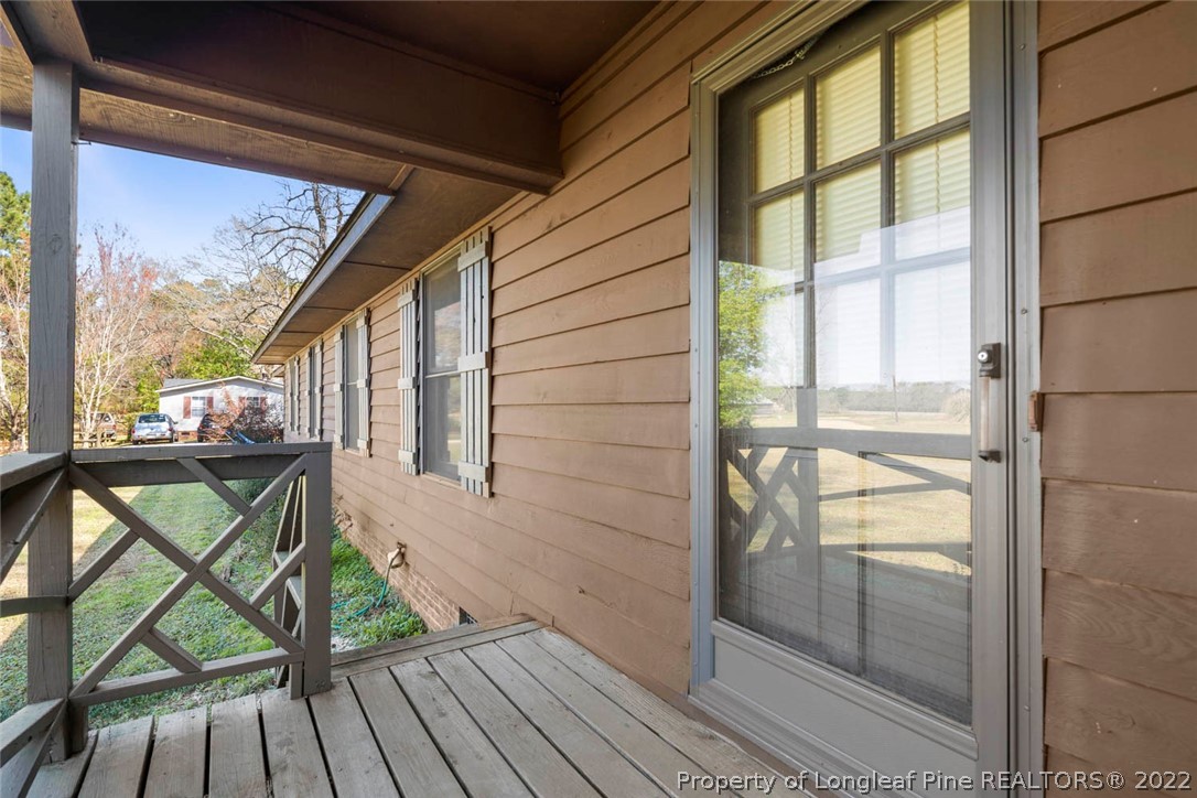 5011 Maxwell Road Autryville, NC 28318 - Photo 3 of 36 a view of balcony with wooden floor