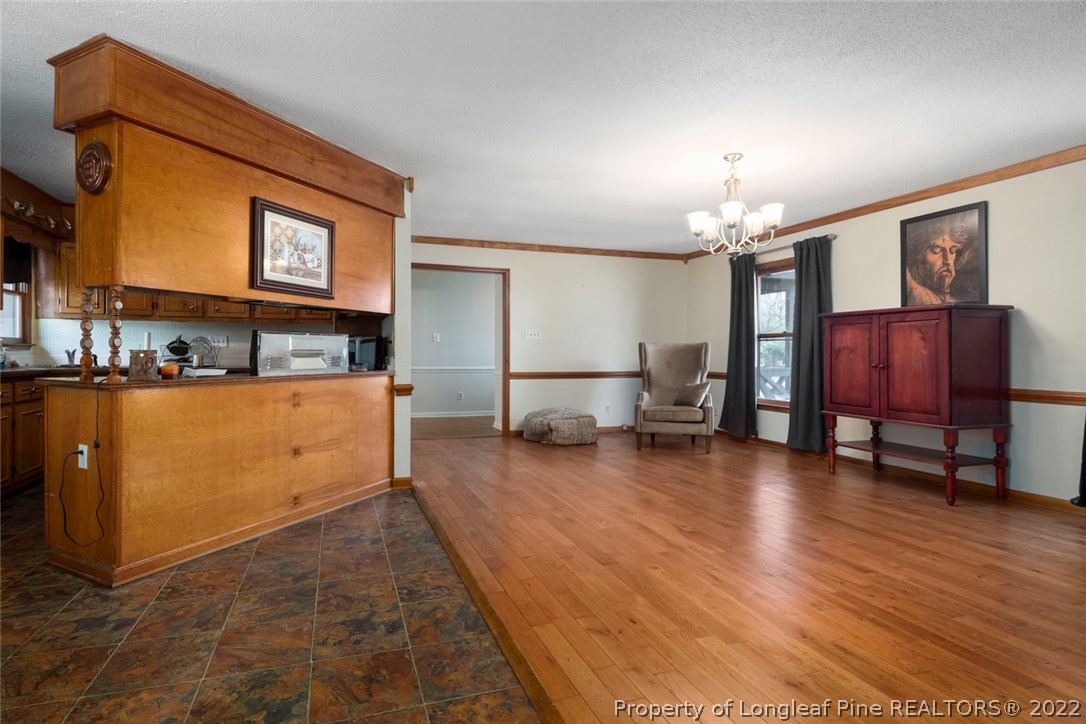 5011 Maxwell Road Autryville, NC 28318 - Photo 10 of 36 a living room with furniture and a wooden floor