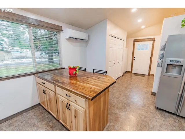 a kitchen that has a sink and a stove