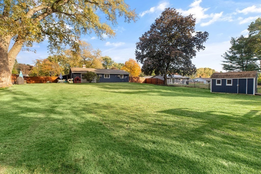 10 Clara Road Framingham, MA 01701 - Photo 32 of 42 a view of a big yard with a house in the background