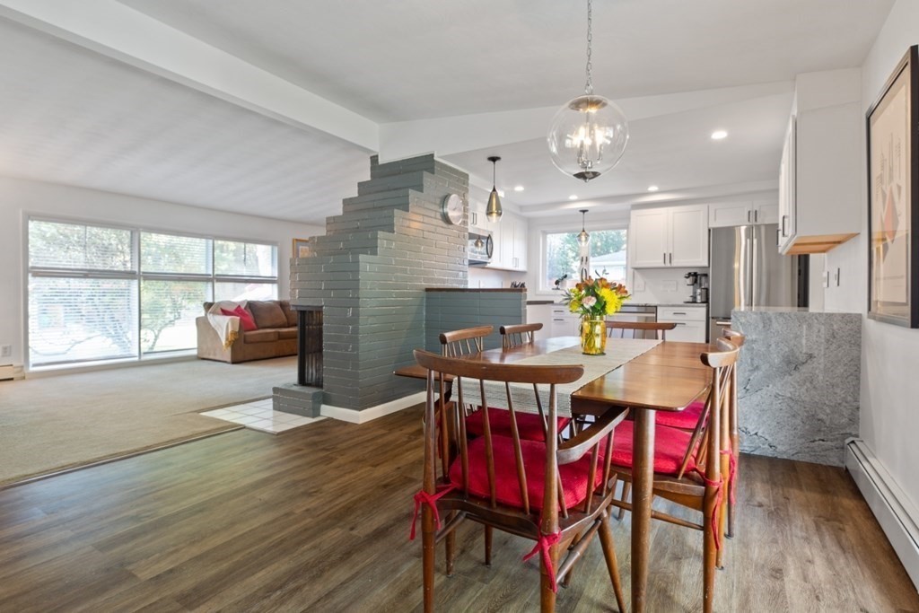 10 Clara Road Framingham, MA 01701 - Photo 5 of 42 a view of a dining room with furniture wooden floor and chandelier