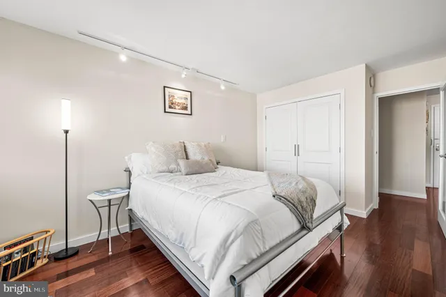 a bedroom with a bed and a table