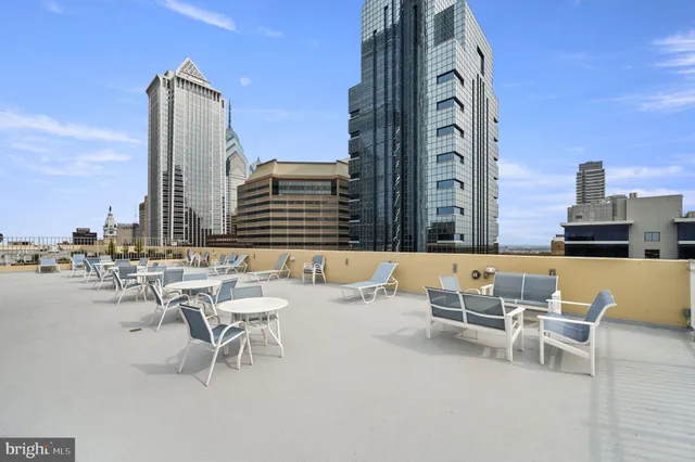a bathroom with a tub a double vanity sink and a mirror