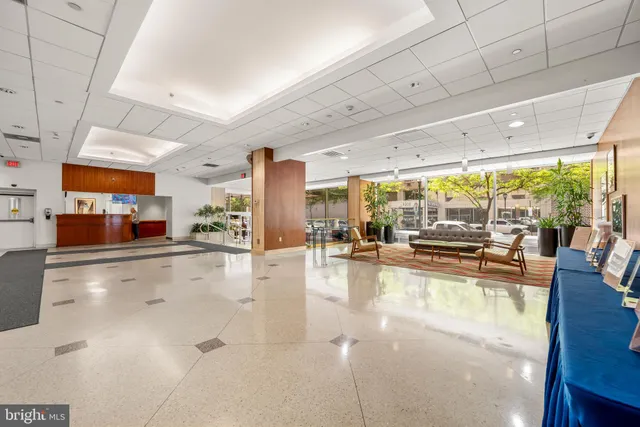 a view of a living room with kitchen