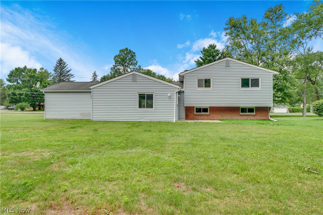 646 Ledge Road Macedonia, OH 44056 - Photo 20 of 28 Expansive rear yard featuring green lawn and mature trees