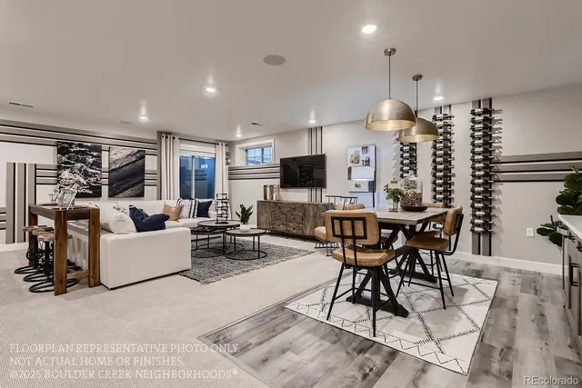 a living room with lots of furniture and a wooden floor