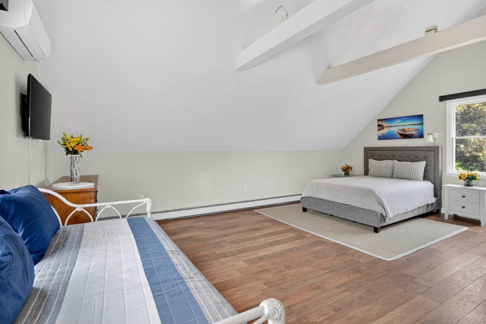 9 Thaxter Lane Edgartown, MA 02539 - Photo 19 of 53 a bedroom with a bed and flat screen tv