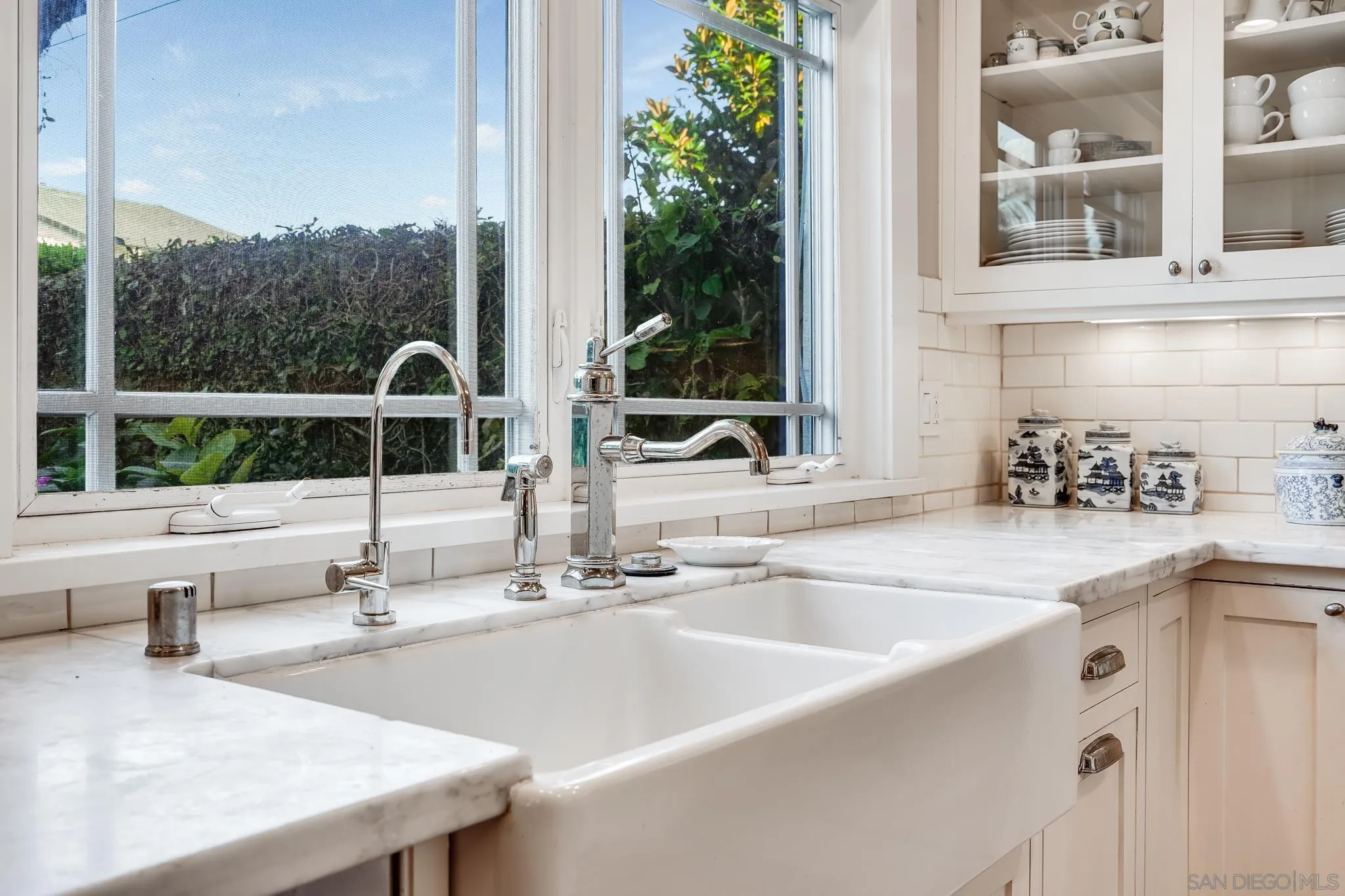 2 The Inlet Coronado, CA 92118 - Photo 15 of 40 a kitchen with a sink and a large window