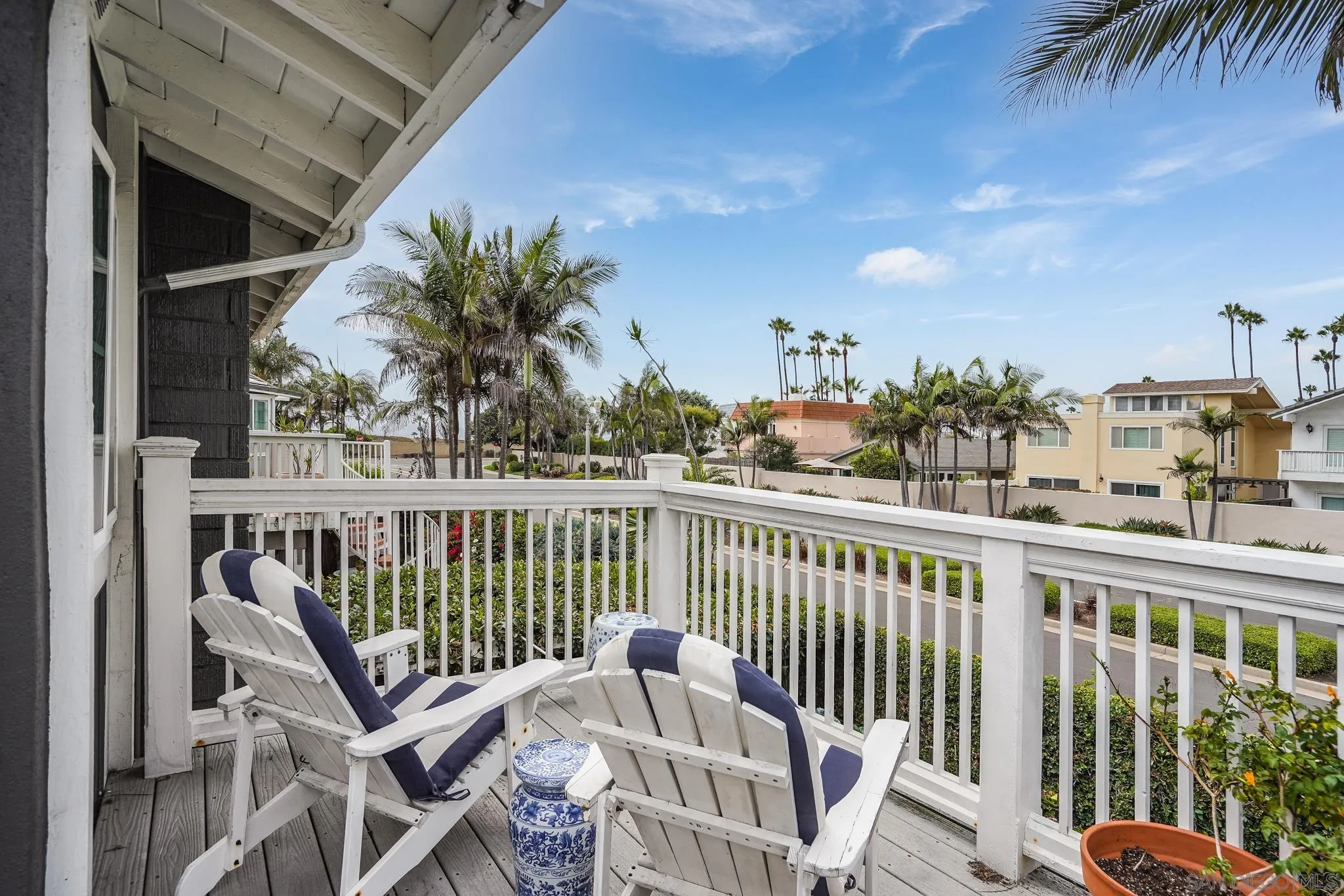 2 The Inlet Coronado, CA 92118 - Photo 16 of 40 a view of a balcony with wooden chairs