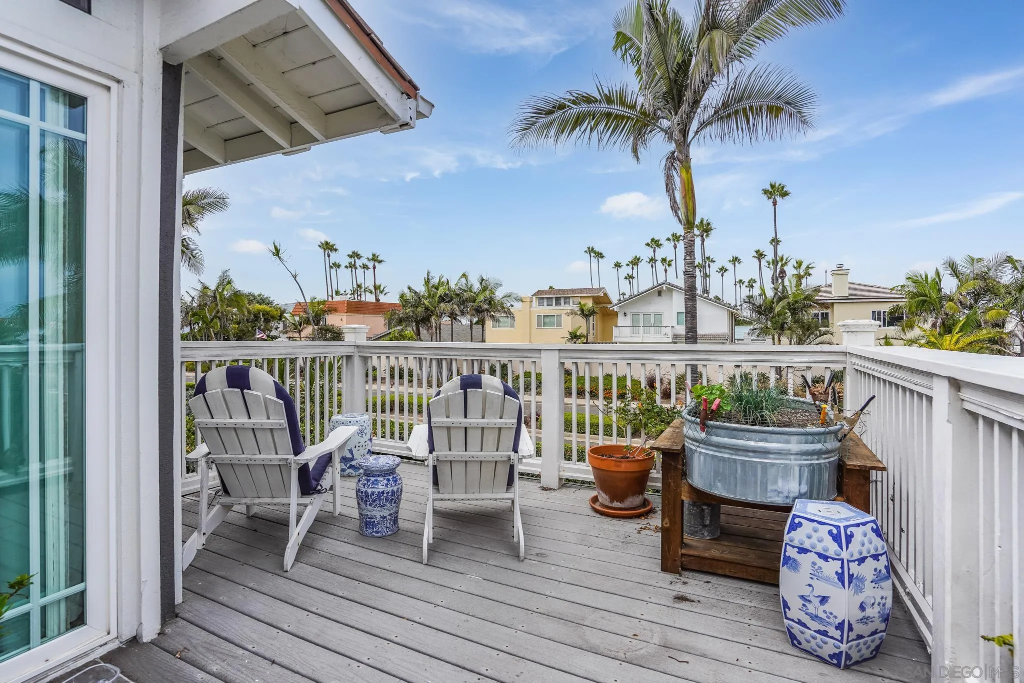 2 The Inlet Coronado, CA 92118 - Photo 17 of 40 a view of a balcony with chair and wooden floor