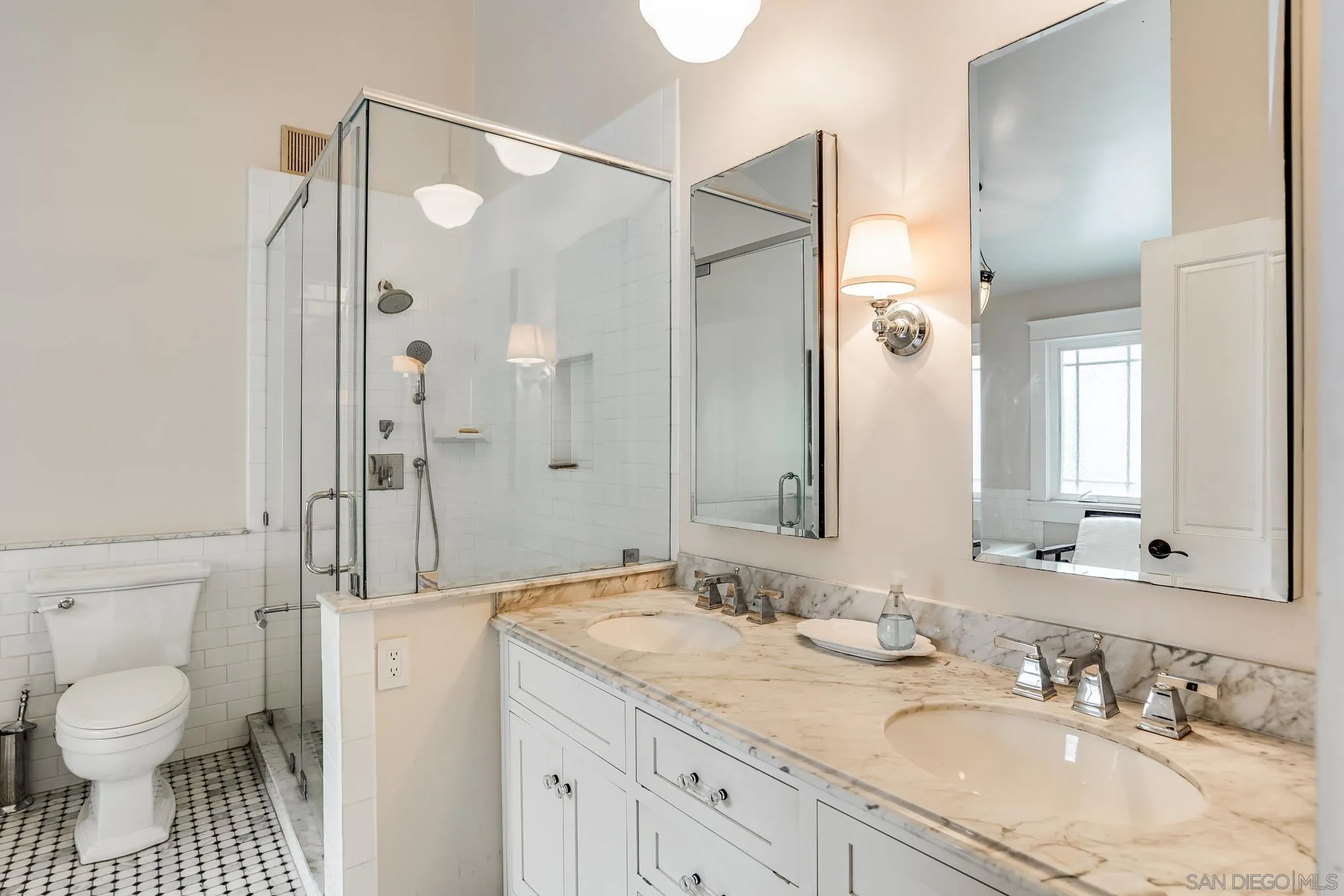 2 The Inlet Coronado, CA 92118 - Photo 20 of 40 a bathroom with a granite countertop sink a toilet and a shower