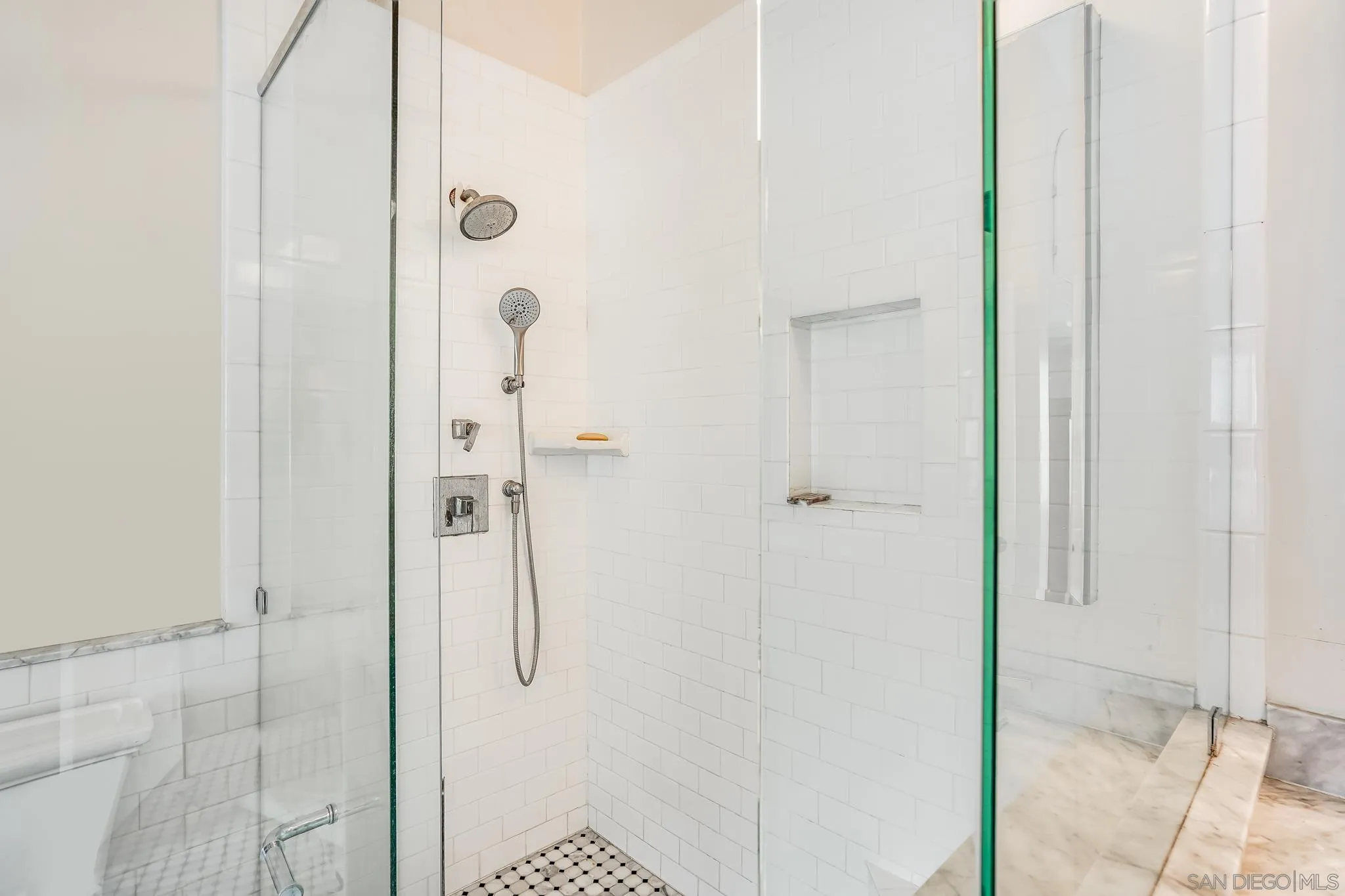 2 The Inlet Coronado, CA 92118 - Photo 21 of 40 a bathroom with a glass shower door