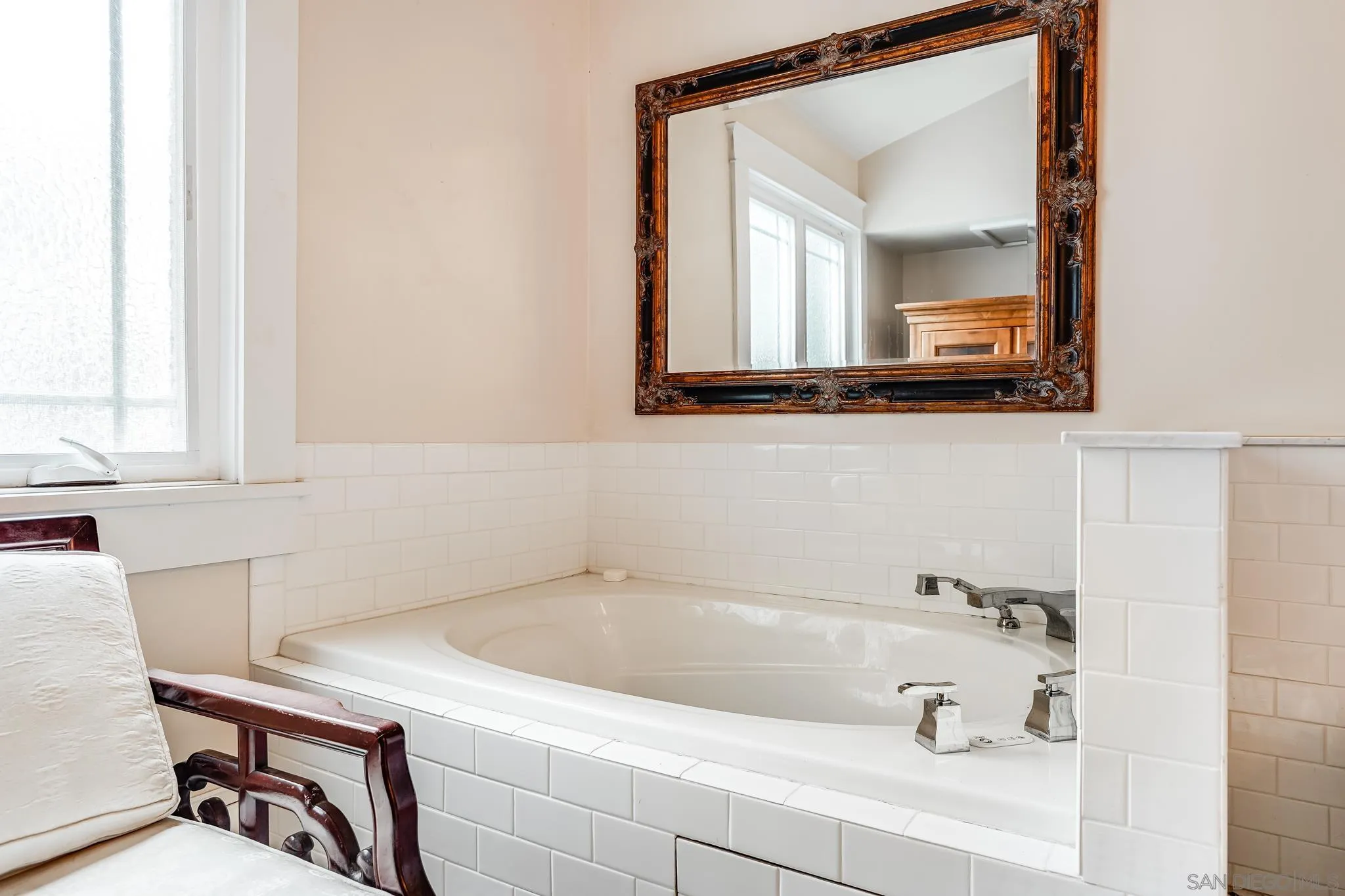 2 The Inlet Coronado, CA 92118 - Photo 22 of 40 a bathroom with a tub sink and mirror
