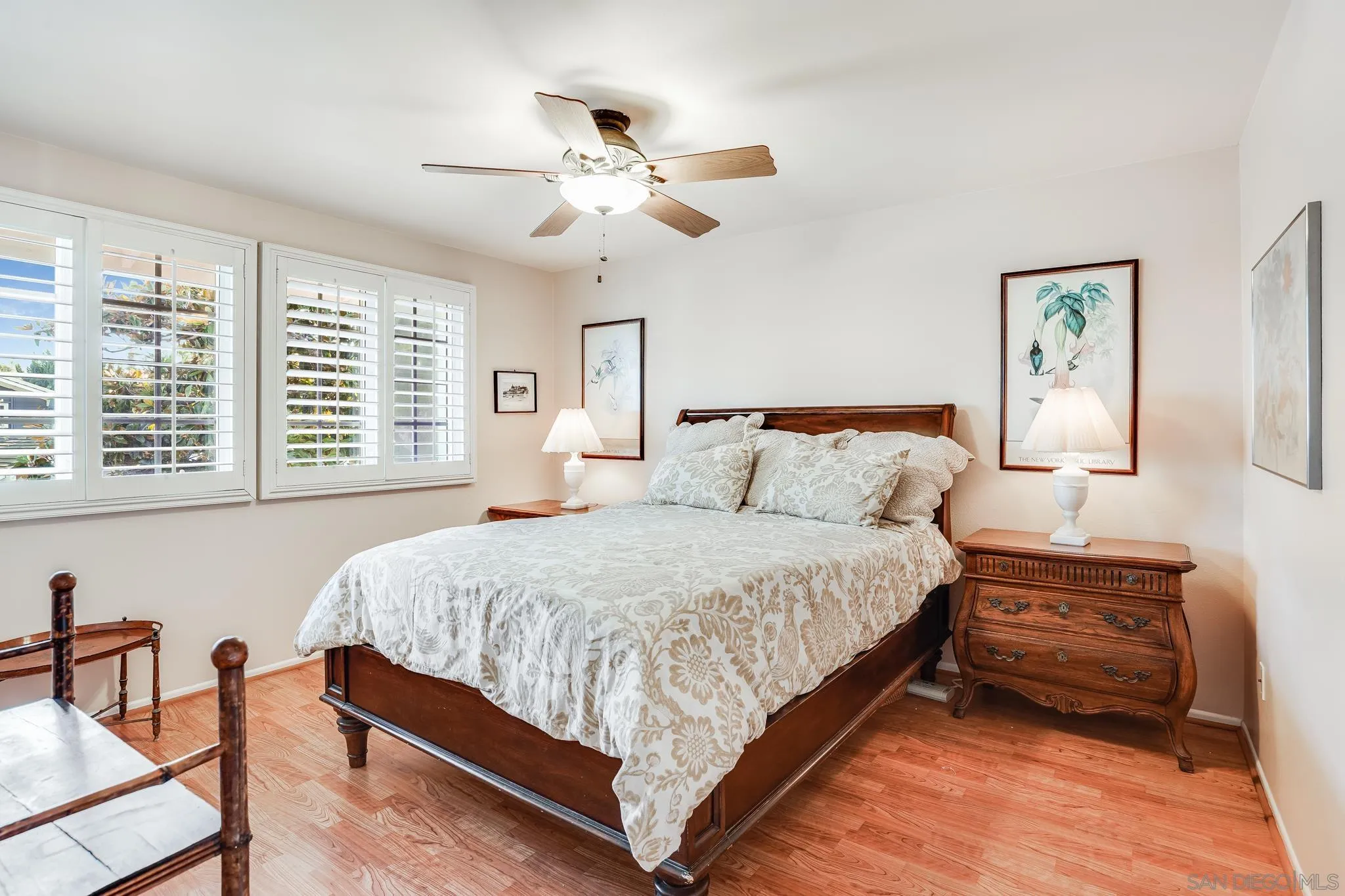 2 The Inlet Coronado, CA 92118 - Photo 23 of 40 a bedroom with a bed and a chandelier