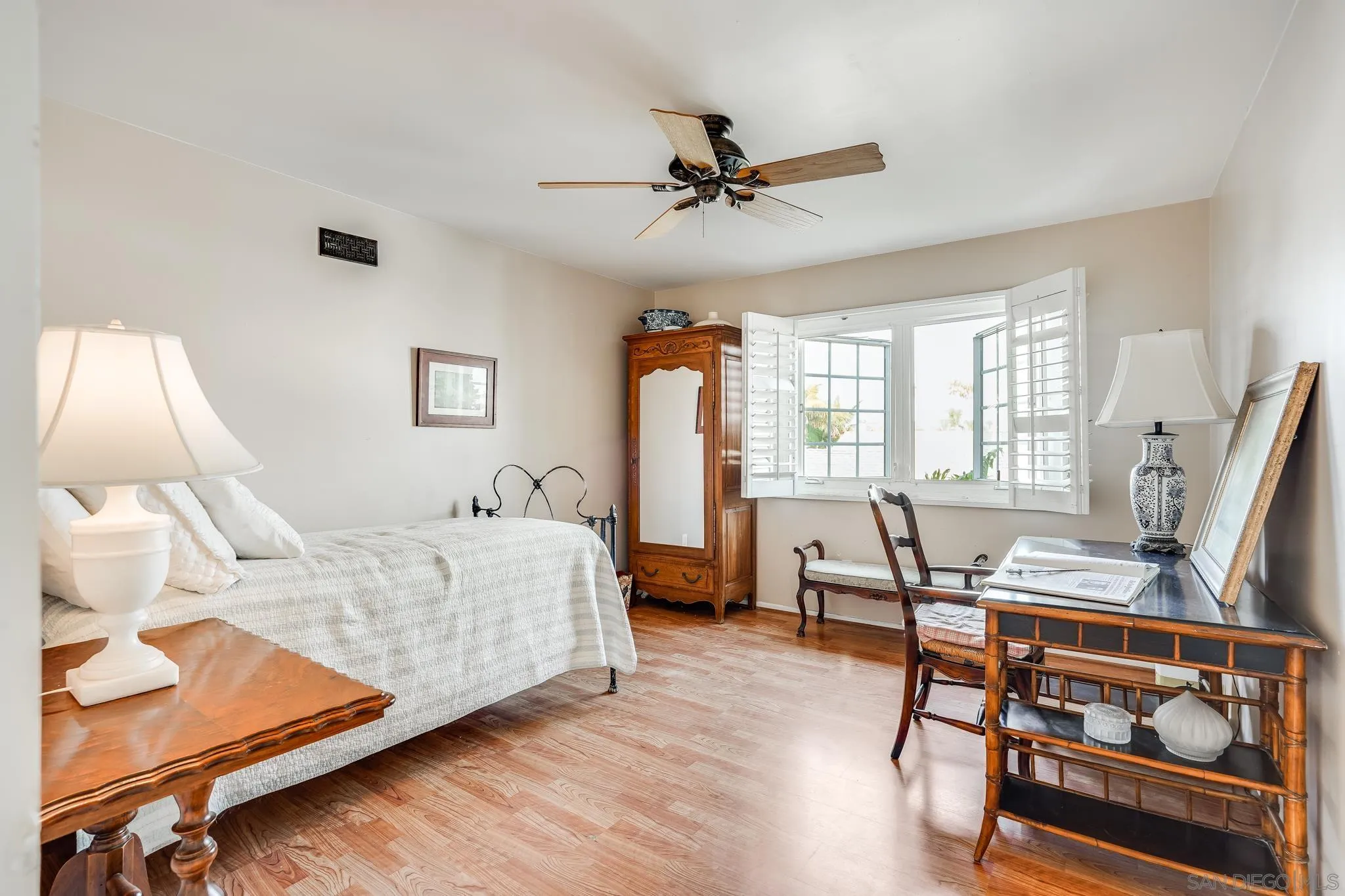 2 The Inlet Coronado, CA 92118 - Photo 24 of 40 a bedroom with furniture window and wooden floor