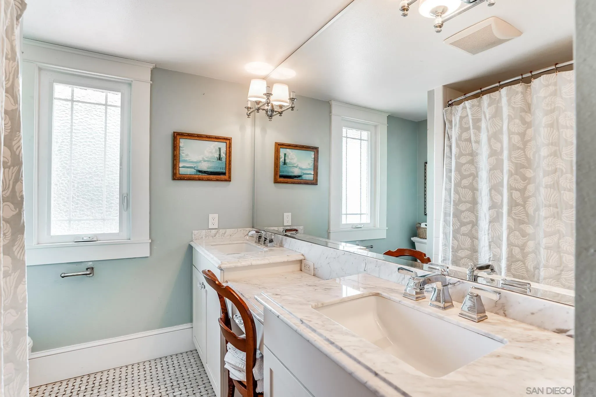 2 The Inlet Coronado, CA 92118 - Photo 26 of 40 a bathroom with a sink a vanity and a mirror