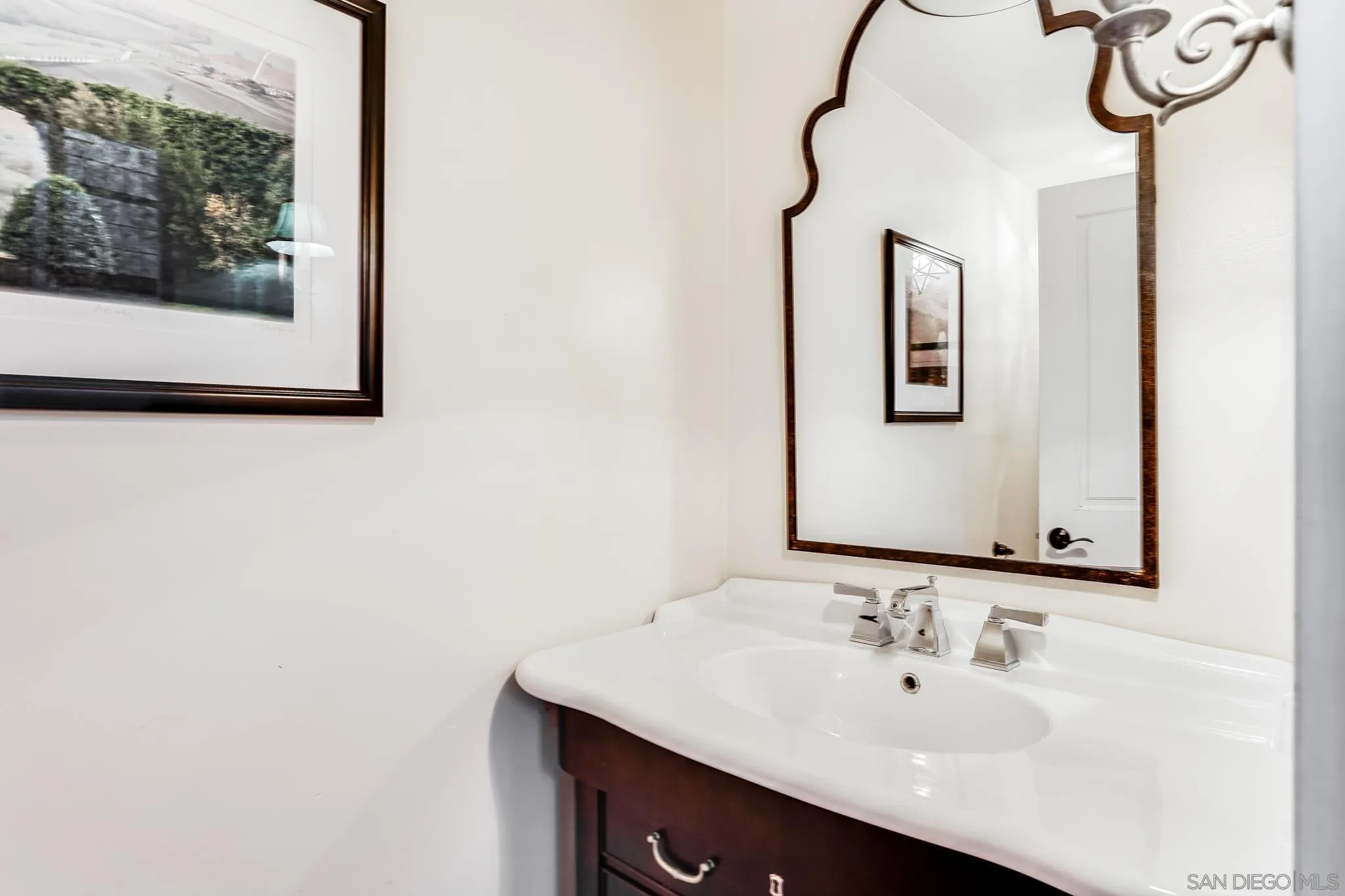 2 The Inlet Coronado, CA 92118 - Photo 30 of 40 a bathroom with a sink and a mirror