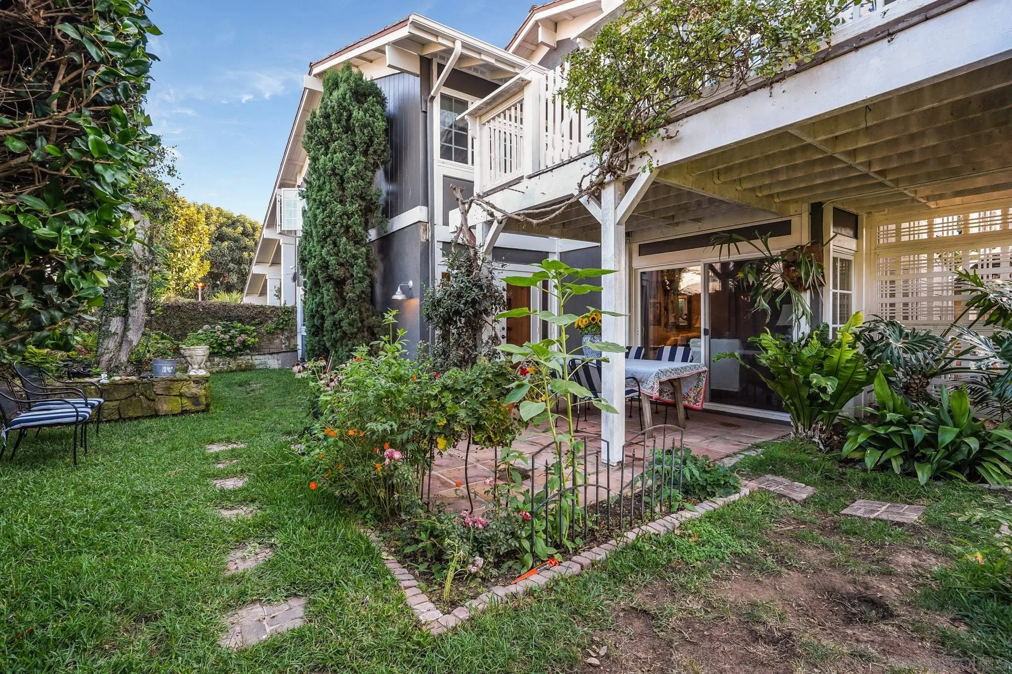 2 The Inlet Coronado, CA 92118 - Photo 31 of 40 a view of a building with a garden and sitting area