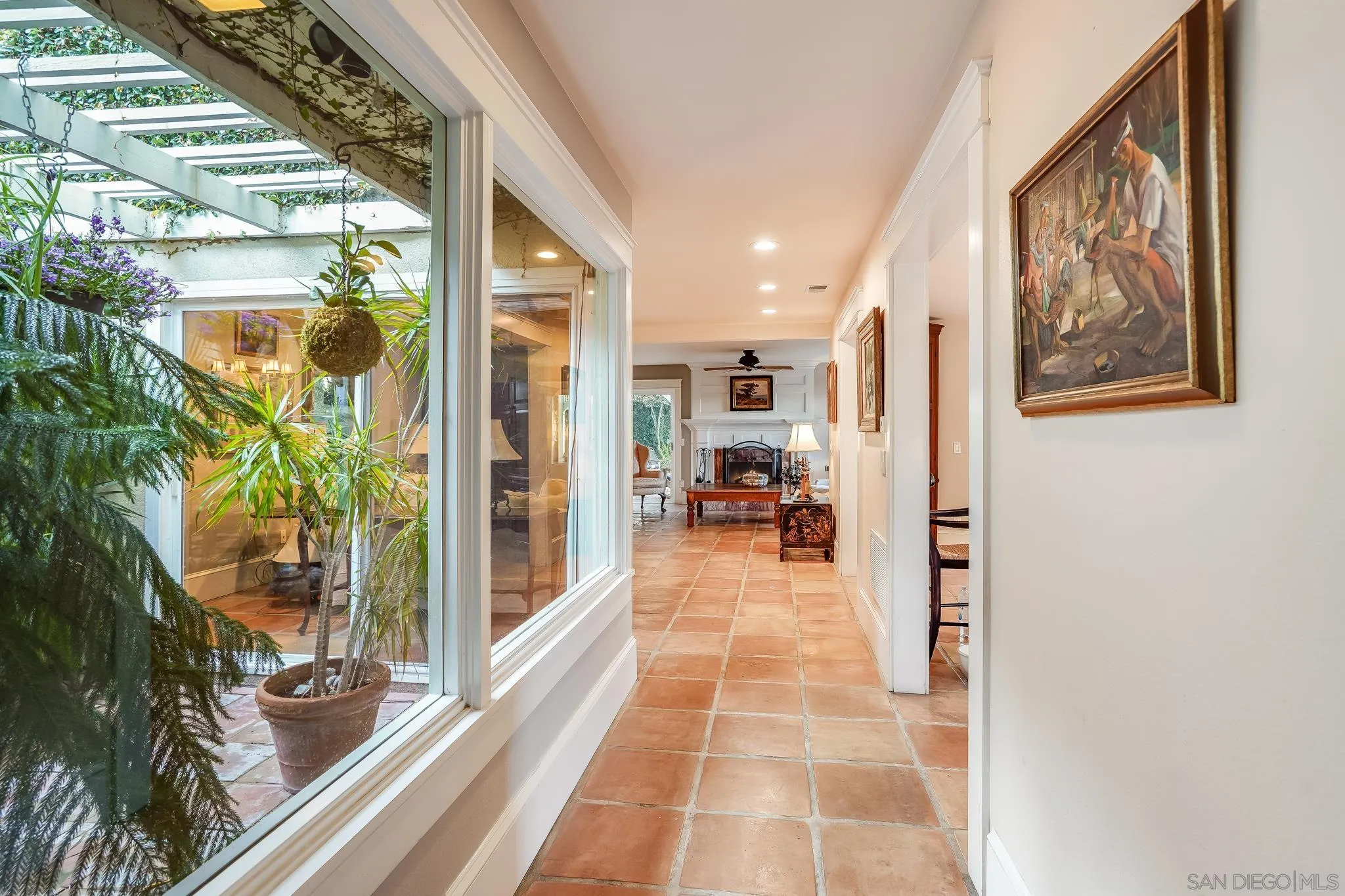 2 The Inlet Coronado, CA 92118 - Photo 5 of 40 a hallway with a large stone wall and a large window
