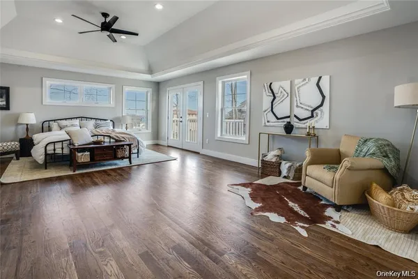 a living room with fireplace furniture and a wooden floor