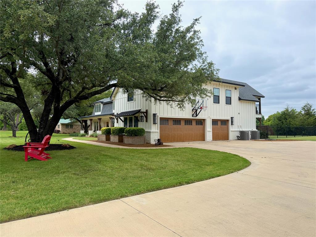 1304 Tinker Road Colleyville, TX 76034 - Photo 3 of 28 a front view of a house with garden