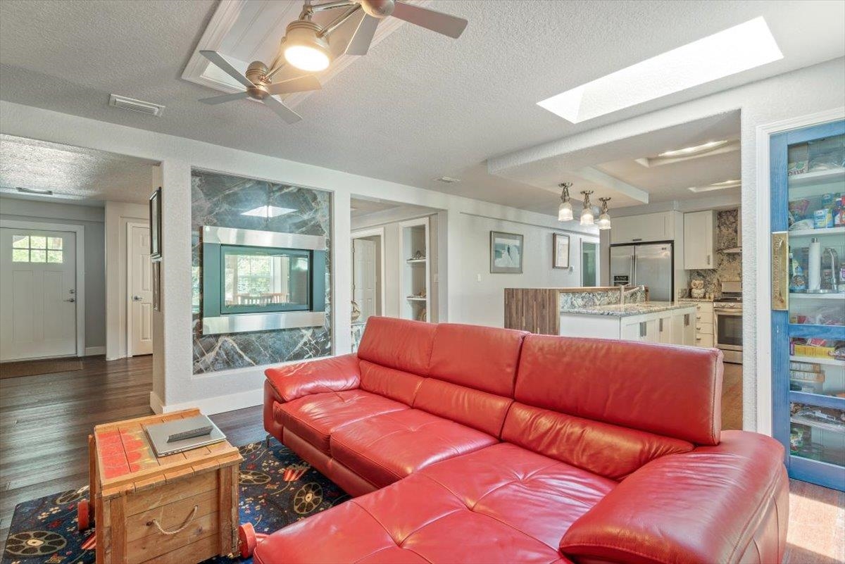6342 Salado Road St. Augustine, FL 32080 - Photo 17 of 74 a living room with furniture with kitchen view