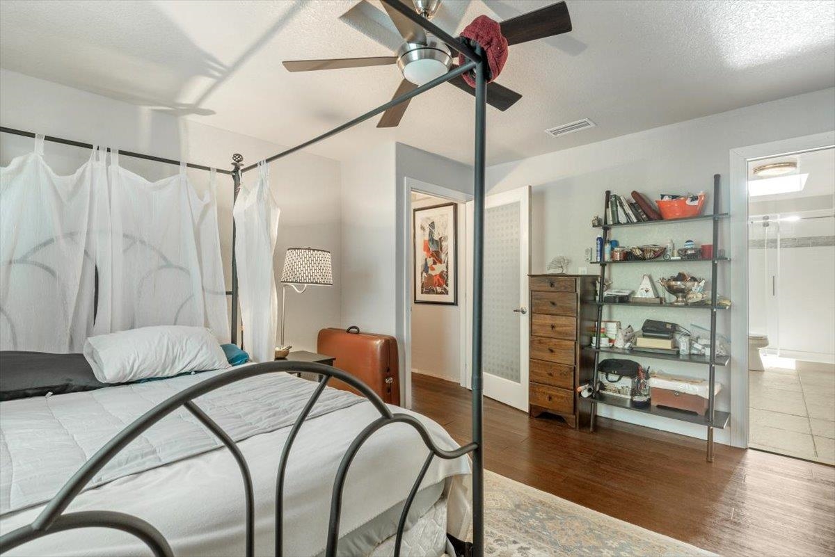 6342 Salado Road St. Augustine, FL 32080 - Photo 30 of 74 a bedroom with furniture and a book shelf