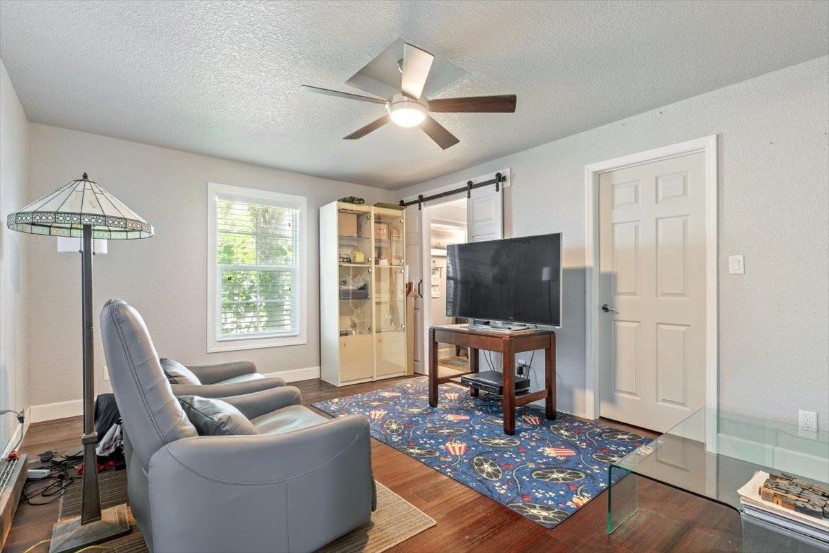 6342 Salado Road St. Augustine, FL 32080 - Photo 35 of 74 a living room with furniture and a flat screen tv