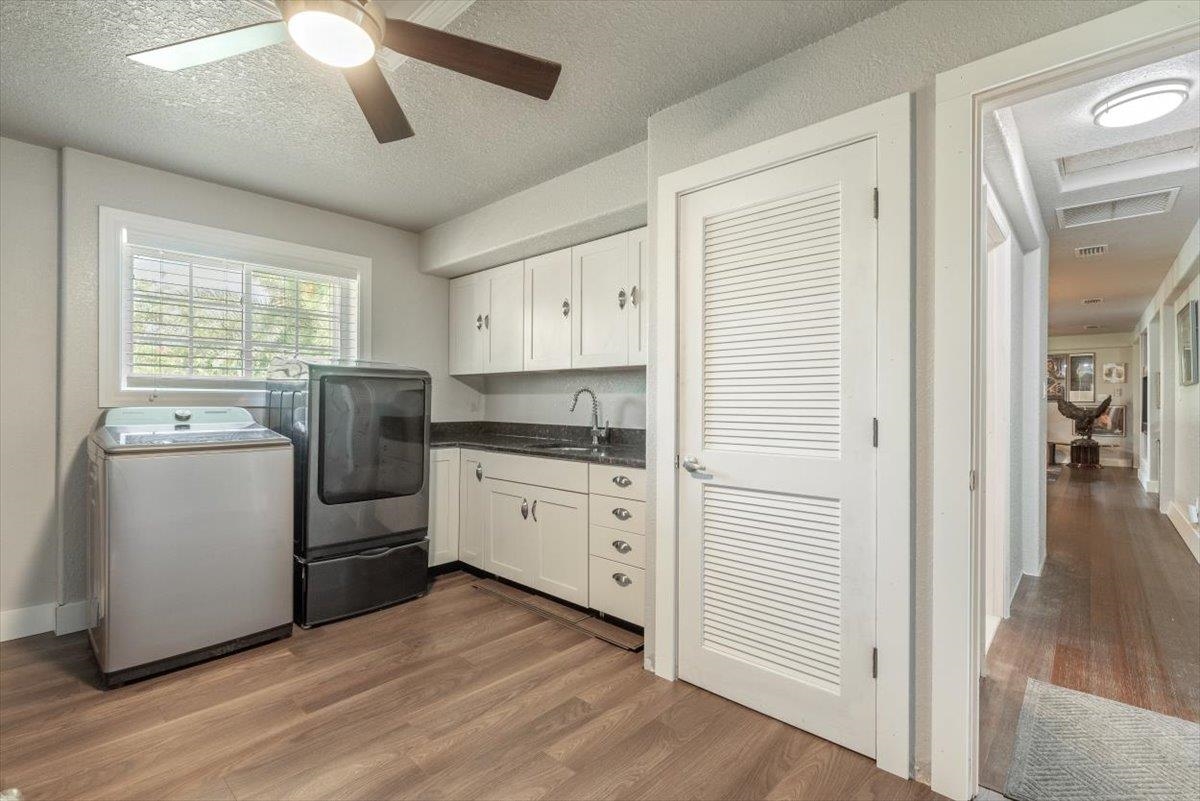6342 Salado Road St. Augustine, FL 32080 - Photo 38 of 74 a kitchen with refrigerator cabinets and wooden floor