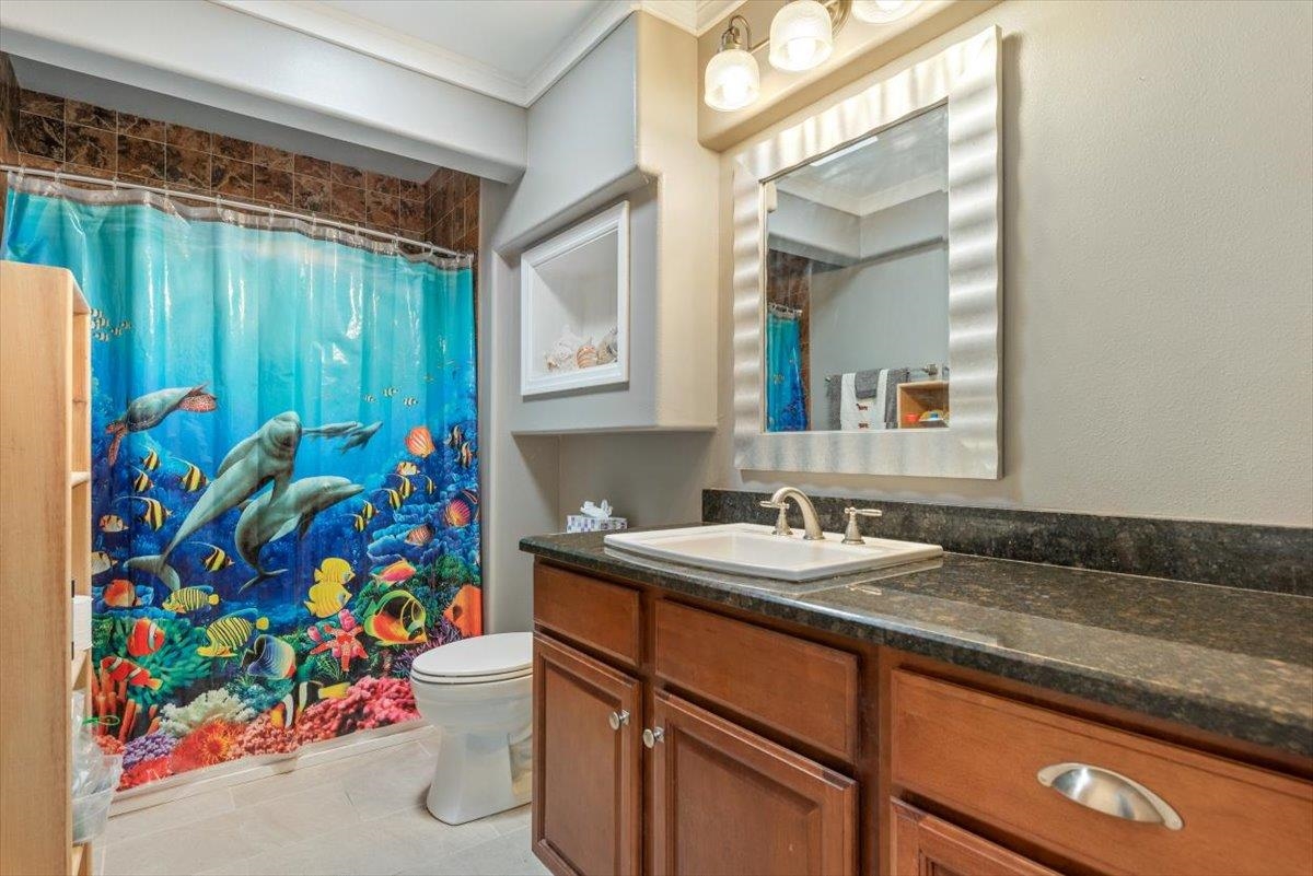 6342 Salado Road St. Augustine, FL 32080 - Photo 40 of 74 a bathroom with a sink and a mirror