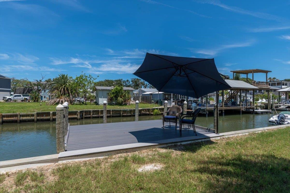 6342 Salado Road St. Augustine, FL 32080 - Photo 42 of 74 a view of swimming pool with outdoor seating and lake