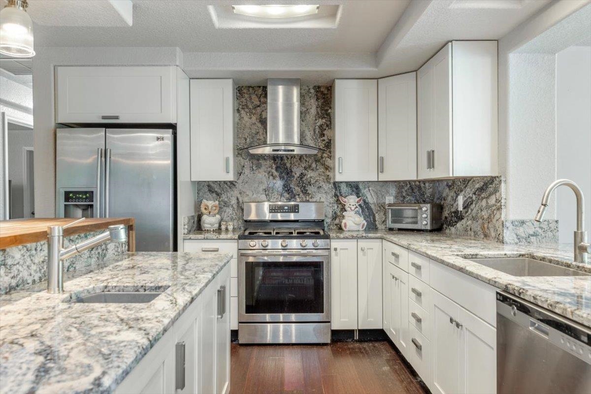 6342 Salado Road St. Augustine, FL 32080 - Photo 5 of 74 a kitchen with stainless steel appliances granite countertop a stove and a sink
