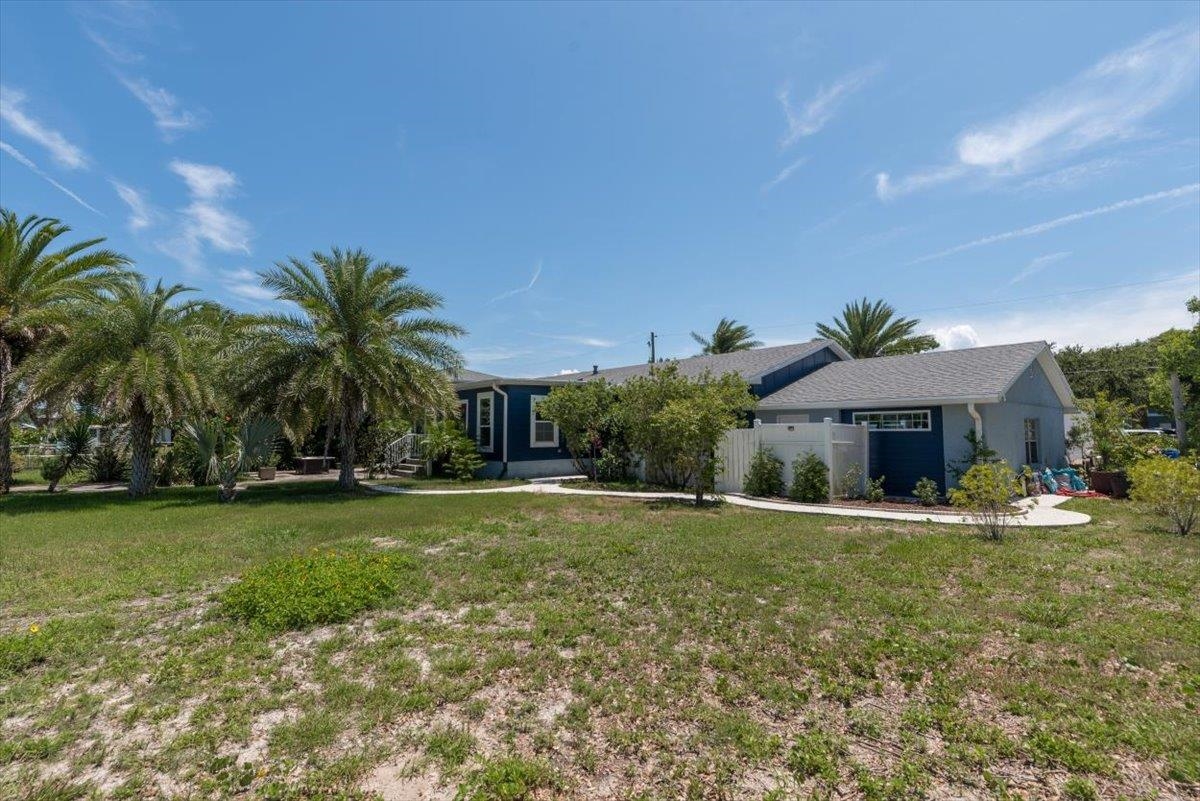 6342 Salado Road St. Augustine, FL 32080 - Photo 54 of 74 a view of a house with a yard and potted plants