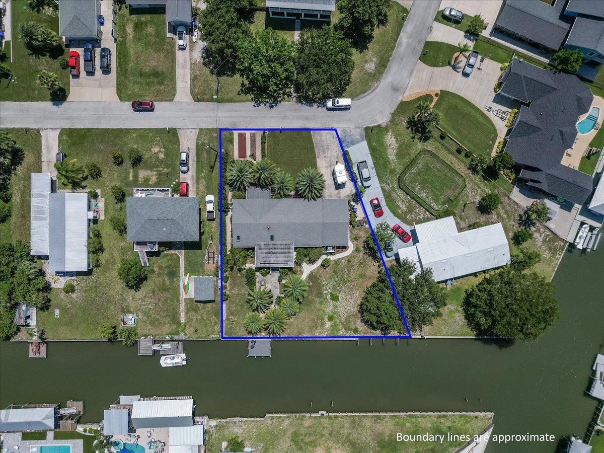 6342 Salado Road St. Augustine, FL 32080 - Photo 68 of 74 an aerial view of a house with a lake view