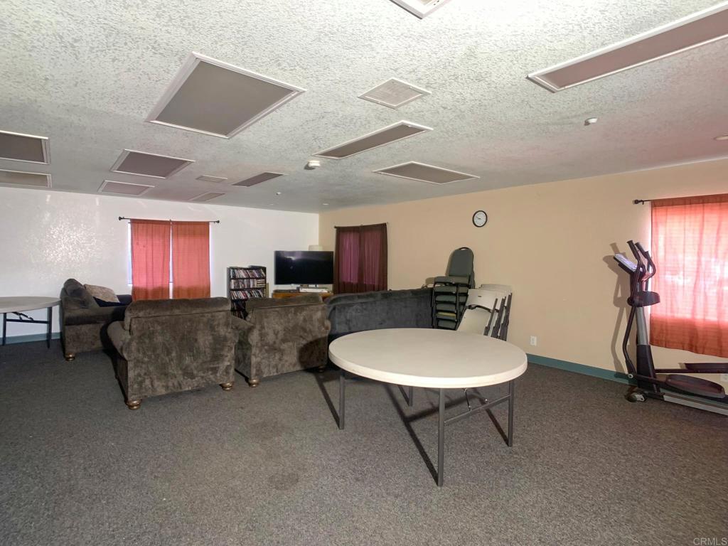 24352 Featherstone Canyon Road Lakeside, CA 92040 - Photo 23 of 75 a living room with furniture a air conditioner vent and a window