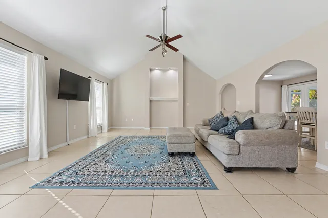 a bathroom with a shower curtain and a toilet