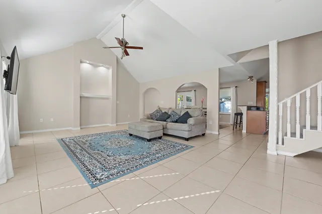a white toilet sitting next to a bath tub