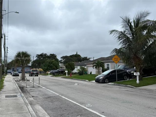 a group of cars parked in front of building