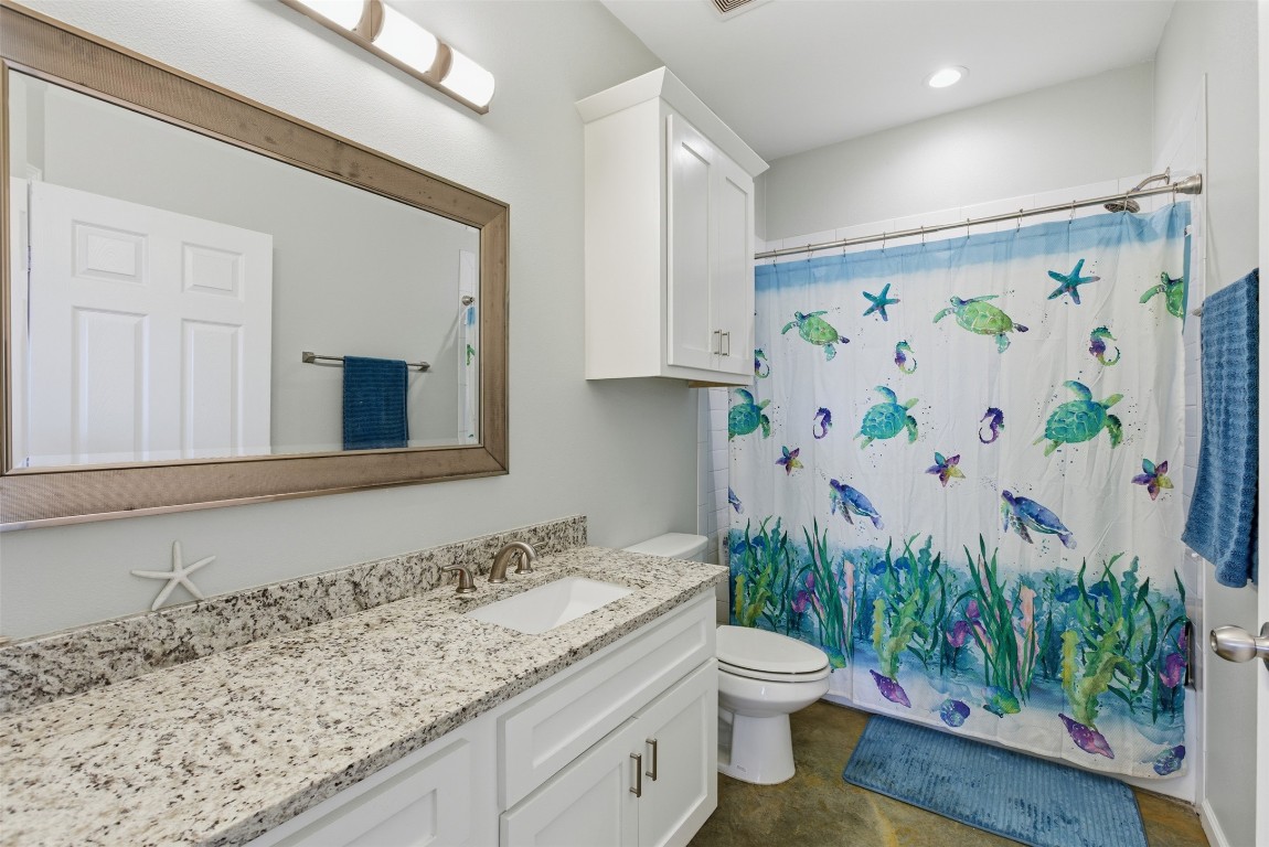 152 Spring Hollow Trail Smithville, TX 78957 - Photo 11 of 17 a bathroom with a granite countertop sink and a toilet