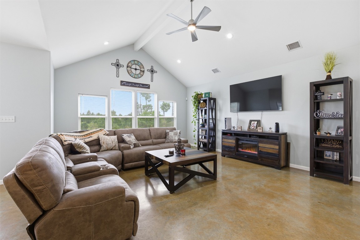 152 Spring Hollow Trail Smithville, TX 78957 - Photo 2 of 17 a living room with furniture and a flat screen tv