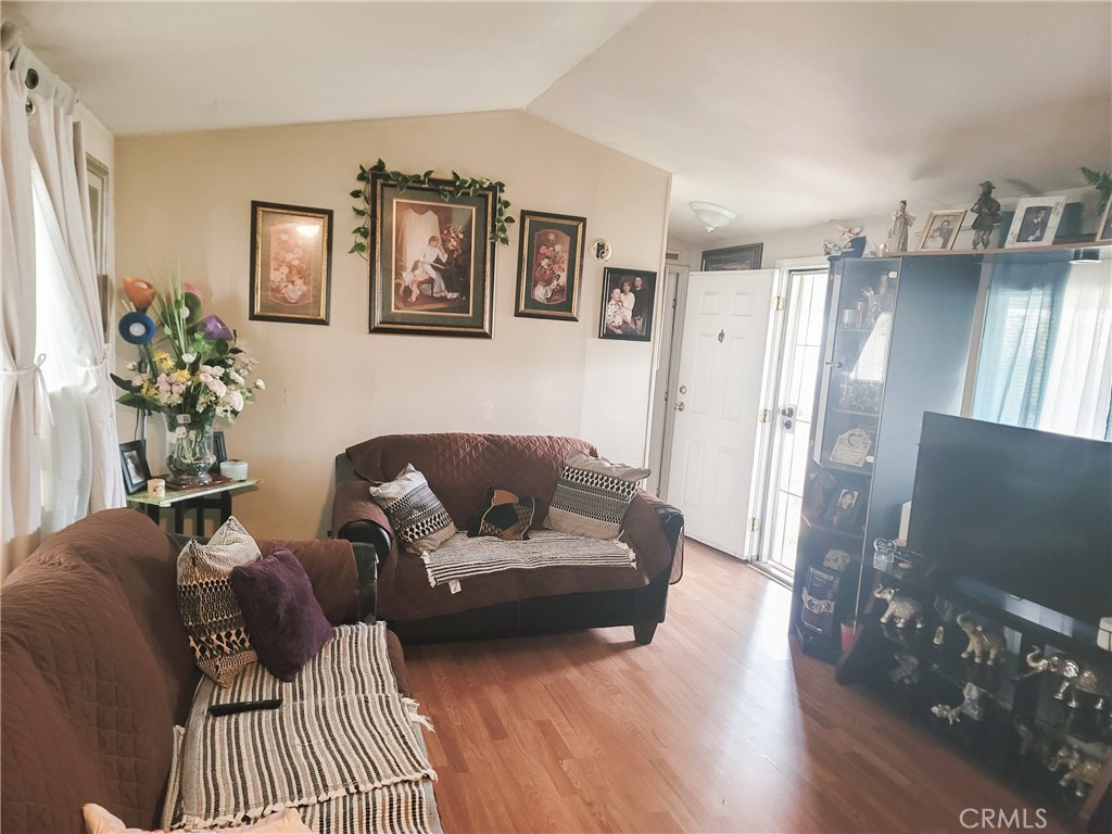 2500 North State Highway 59, Unit 278 Merced, CA 95348 - Photo 11 of 30 a living room with furniture and a flat screen tv