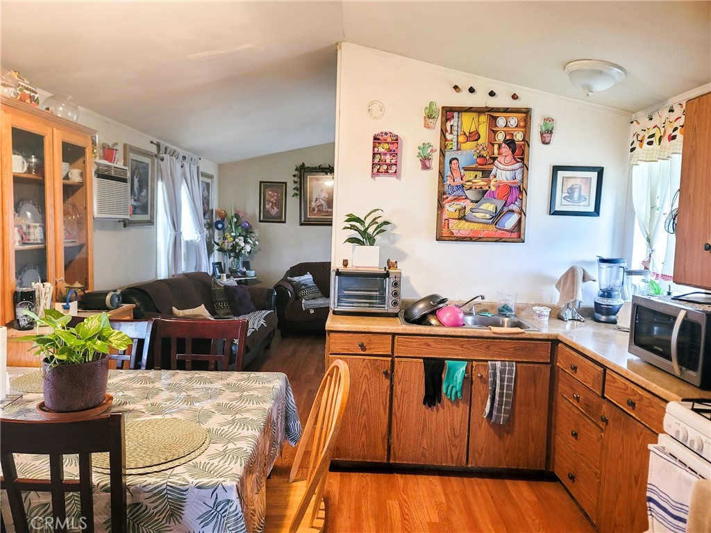 2500 North State Highway 59, Unit 278 Merced, CA 95348 - Photo 2 of 30 a living room with furniture and a potted plant