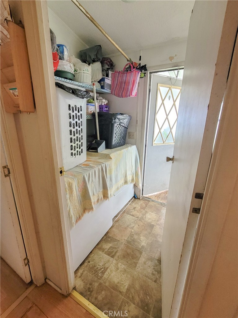 2500 North State Highway 59, Unit 278 Merced, CA 95348 - Photo 22 of 30 a view of a bedroom with baby crib and furniture