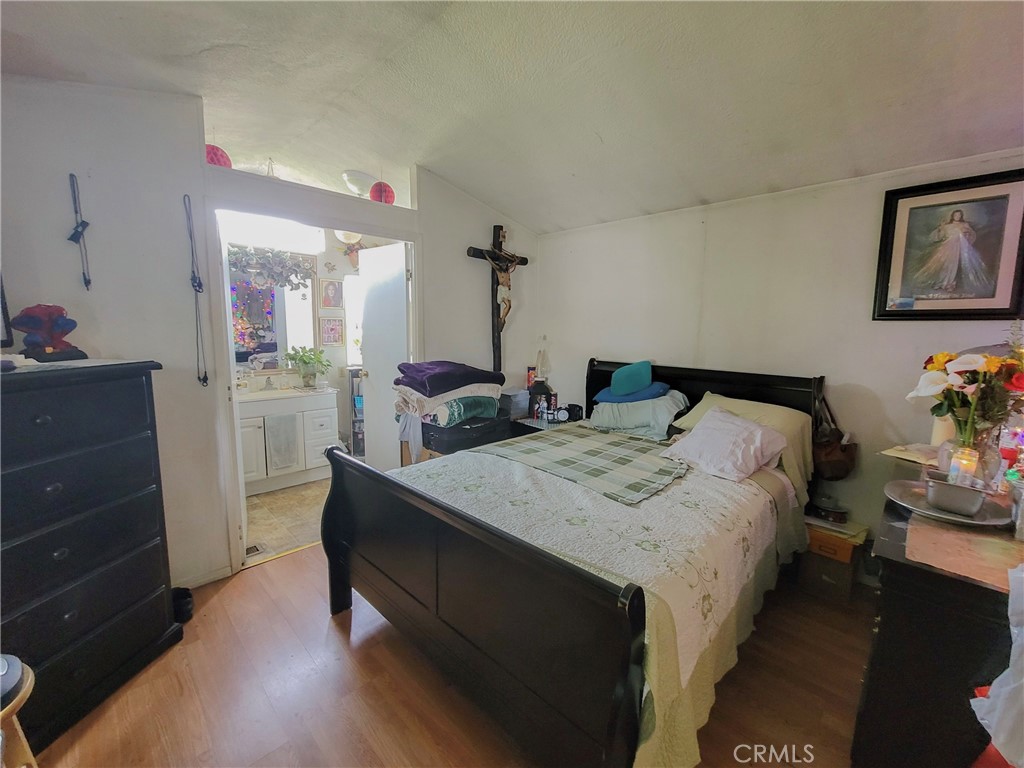 2500 North State Highway 59, Unit 278 Merced, CA 95348 - Photo 26 of 30 a bedroom with a bed and a dresser