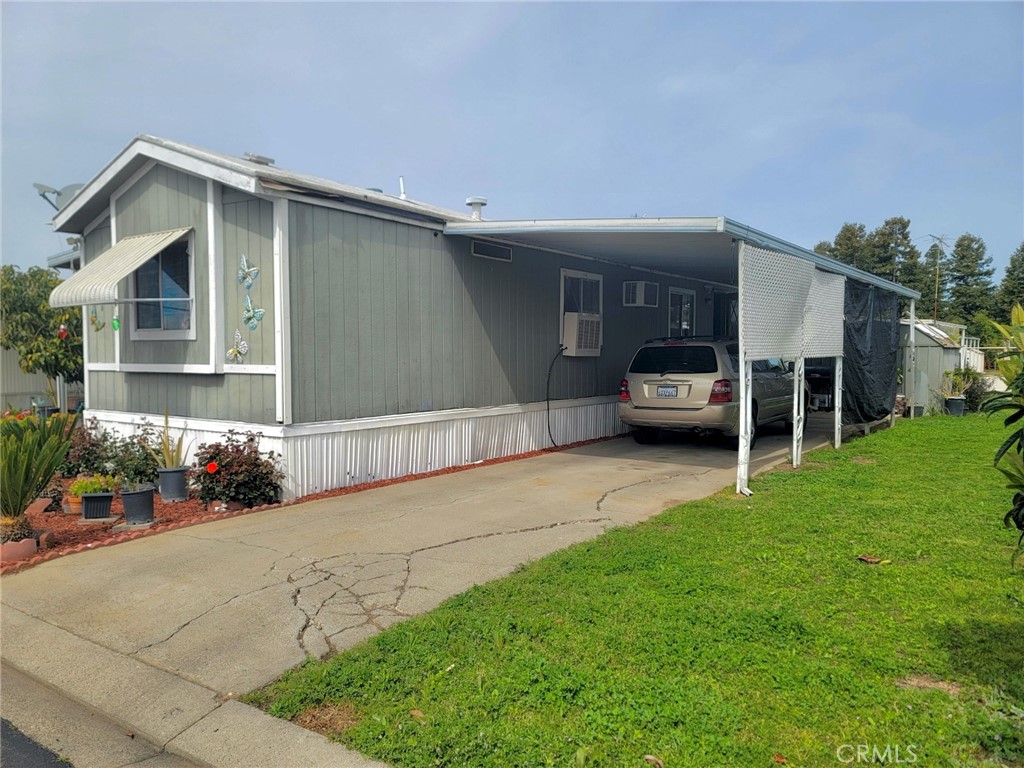 2500 North State Highway 59, Unit 278 Merced, CA 95348 - Photo 9 of 30 a front view of a house with a garden and patio