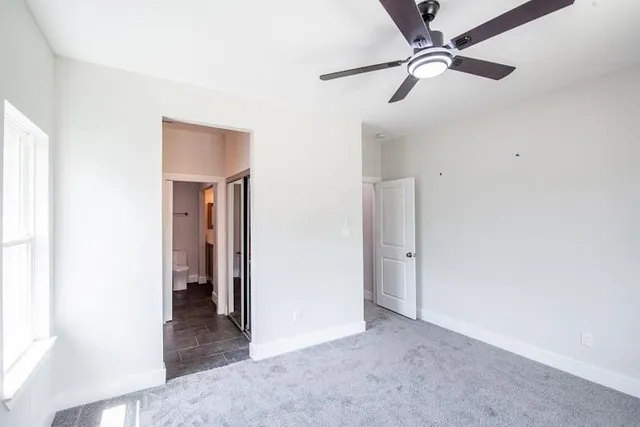 a bathroom with a sink vanity and a toilet