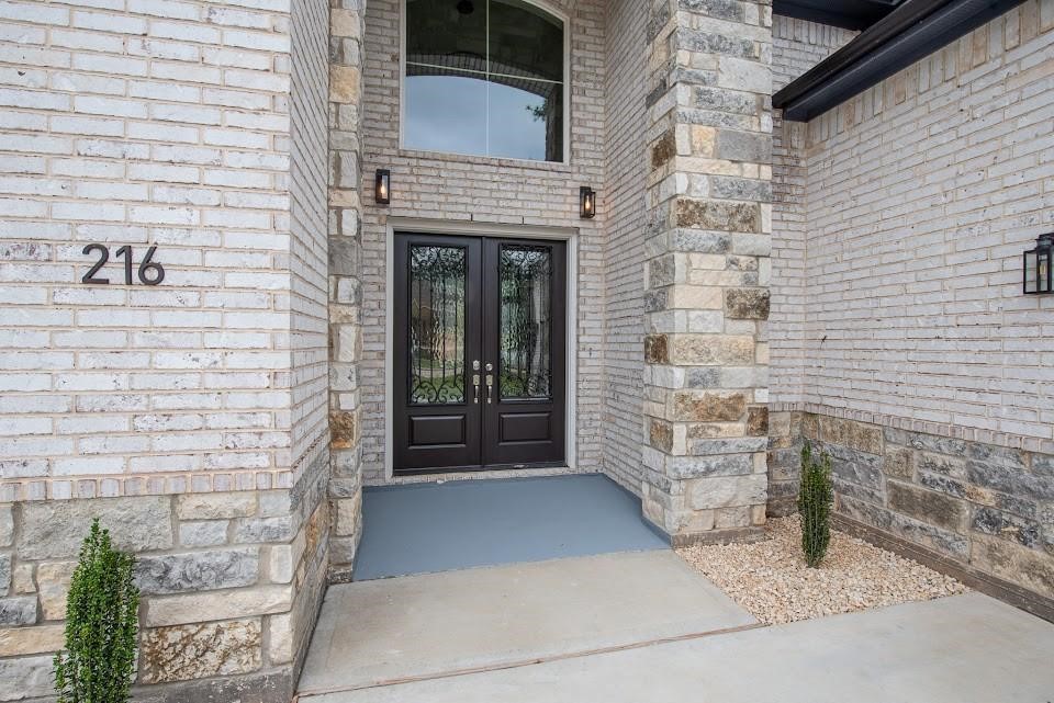 216 Monterrey Road West Montgomery, TX 77356 - Photo 2 of 26 a view of front door of a house with an empty space