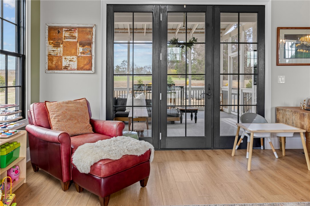 677 Lightwood Road Hartwell, GA 30643 - Photo 7 of 42 This inviting living space features expansive glass doors that open to a charming outdoor area.